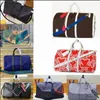 Hommes Duffle Sac Designer Femmes Sacs de voyage Bagages à main Casual Sport Packs de plein air de luxe PU Sacs à main en cuir Grand sac à bandoulière Totes Dcfh