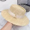 Chapeau de paille de styliste d'été pour hommes et femmes, chapeau de plage unisexe, tresse d'herbe, Protection solaire, seau plat à la mode