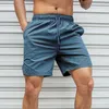 Mäns shorts Fem-punkts snabbtorkande fast färg strandbyxor sport fitness baddräkt surf slitage brädet