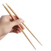 Chopsticks eleganta sushi -nudlar spetsiga trähushållsgortabellköksredskap