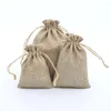 Presentförpackning 100 st 7x9 cm naturlig färg jute dragkammare säckväska väskor godis smycken paket påsar för förvaring/ bröllopsdekor