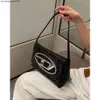 Borsa Designer Boom Brand Pelle con sensazione di fascia alta Nicchia Spicy Girl Style Borsa sottobraccio argento Hobo Dingdang Stick femminile