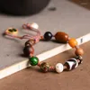 Charm Armband Tibetan Tiger Teeth Dzi Bead Multi-Treasure Armband Dopamine Women's Justerable String Niche All-Strap Retro Accessori