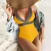 Costume da bagno intero da donna con collo appeso e costume da bagno bikini aderente sexy senza schienale con controllo della pancia arrotolato