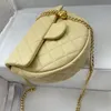 Diseñador Luxury New Camellia Golden Ball Series Bolsa de silla de montar hecha de alto brillo de piel de oveja Bolsa de hombro para mujer disponible en blanco negro y amarillo