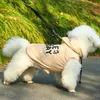 Vestuário para cães 2024 Casual Pet Roupas de quatro pernas Desenho de moda pode puxar capuz pequenos suprimentos