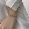 Hoogwaardige ontwerper Tifanccy zilveren armband met imitatie diamant zeven kleuren witte schaal creatieve vrouwelijke dubbele T -armband