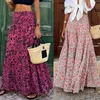 Kjolar vintage boho kjol för kvinnor elastisk midja bohemisk tryckt flytande golvlängd strandkant rufsar lager maxi lång
