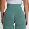 Pantalones de yoga sin hilos incómodos de elevación de la cadera pantalones cortos apretados de gimnasio