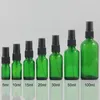 Bouteilles de rangement en gros parfum en verre de voyage Atomizer 20 ml d'emballage vert avec pompe en plastique noir
