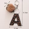 Fashion Leopard 26 Lettere Tornario Purry Pom Pom Ball pendenti per portachiavi per auto Accessori PU Leather Leather Cowboy Style Keyring