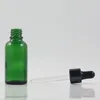 Garrafas de armazenamento atacado 1 oz Garraco de gotas de vidro verde 30 ml embalagens cosméticas com preto