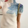 Модная печать с высокой шеей эластичной тонкой фитинговой футболки с длинной плиссированной юбкой с двумя частями 2024 Осенняя элегантная женская юбка набор 240423