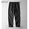 Pantalon masculin 2024 hommes à la taille élastique décontractée en lin blanc massif blanc de poche pantalon de poche plus taille 3xl massive de mode de mode élégante