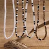 Choker ingesight.z Colliers de perles en bois de mélange naturel de mélange naturel vintage Réglage pour hommes Boho Noir blanc mou