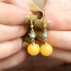 Boucles d'oreilles en peluche enracinées turquoise jaune de cire d'abeilles longues de style chinois