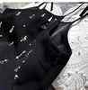 Casual jurken sall size 2024 mode zomer vrouwen sexy veter mouwloze geborduurde fakkels backless mini zwarte jurk