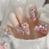 24 -stenset lange ovale valse nagels 3D hart sprankelende Franse pers op roze volledige deksel nep nagels crystal edelstenen ontwerptips 240430