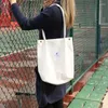 Totes 2024 Mulheres Cordamento Saco de ombro reutilizável Bolsas de compras dobráveis