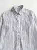البلوزات النسائية بلوزة تنيو مقلمًا في وقت مبكر من الخريف فضفاضة طويلة الأكمام الطويلة القميص قميص تنحنح غير متماثل للسيدات