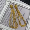 Vintage Quasten Langohrringe Kupfer plattiert echtes Gold Seilmuster Frauen Ohrringschmuck E6580