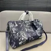 Designer echtes Leder im Freien Reisetasche Frauen Luxusmarke Unisex Duffel Taschen Camouflage Denim Sticked Letter UEUAM