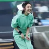 女性用2ピースパンツグリーンスポーツフーディースーツ女性2024春のカジュアルファッションショートフード付きスウェットシャツ