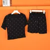 Robes de travail Une lettre en ramine de t-shirt noir en coton élastique et mini-jupe 2 pièces pour femmes 2024 Summer Y2K Tshirt Robe Clothing