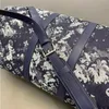 Designer echtes Leder im Freien Reisetasche Frauen Luxusmarke Unisex Duffel Taschen Camouflage Denim Sticked Letter UEUAM