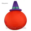 Grand grand ballon de lanterne de la tête de citrouille gonflable à la tête gonflable de la lanterne aérienne souriante avec un chapeau pour la décoration de la fête de l'Hallowmas