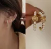 Hoop Huggie Koreańskie kolczyki mody 2021 Trend okrągły złoty kwiat dla kobiet Vintage Pearl Female Ear Stud5725154