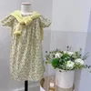 Robes de fille en stock de vêtements de bébé robe coton français décontracté personnalisée jaune floral imprimé