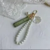 Keychains Lanyards Designer Keychain Luxe Key Chain Bag Charm vrouwelijke auto sleutelring Pearl Charm Groen Ribbon Delicate Shells Keychain Couple Hanger Gift leuk goed