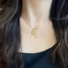 Colliers de créateur de pendentif de marque de luxe 18 carats d'or plaque à eau de lettres de bouteille de haute qualité collier en acier inoxydable