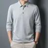 Smart Casual Engeland-stijl Herenwafels Wafel met lange mouwen Polo-shirts Solid Fashion Spring Losse reversknop Patchwork T-shirt Top 240418