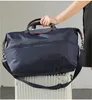 Designväska duffel väskor mode stor kapacitet handväska klassiker resväska kohud pendling bärbara kvinnor män vattentät nylon bagagepåse utomhus sportväska