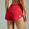 Accélérez les shorts sportifs courts doublés de grande hauteur