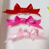 Hundekleidung 1PCS Taktische maltesische Haustier Bogen Kopfschmuck Blumenbandmodelle importiertes Luftpony