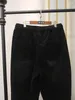 Robes de travail 150 kg de taille élastique d'automne pour femmes pantalon en velours côtelé 6xl 7xl 8xl 9xl coton de poche croisée noire
