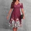 Robes de fête robe en ajustement en ajustement imprimé floral midi A-ligne avec manches courtes en V cou pour les fêtes d'été shopping femme haute taille