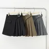 Jupes Mini jupe asymétrique avec boucle femme haute taille plissée enveloppe à la mode