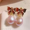 Boucles d'oreilles en pente rose gouttes baroque perle bouton d'oreille papillon 18k oreille étal