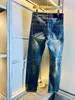 Męskie dżinsy v designer spodnie lekkie luksusowe i modne sprężynowe spodnie kwiatowe amerykański przemysł retro heavy l vvv umyte stare splicing drukowania