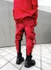 Мужские брюки асимметричная восковая поверхность выдолбленная бегуна грузовая уличная одежда хип -хоп хлопок красные повседневные брюки Мужчины