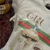 Dames T-shirtontwerper Hoge kwaliteit van de originele standaard lente/zomer Nieuw schattig fruit handgeschilderd t-shirt met Peter konijn ronde nek korte mouw 8zzf