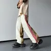 Panelli della tuta Y2K primaverili e autunnali sottili Colore di strada americana abbinati a strisce casual a strisce pantaloni da uomo 240423