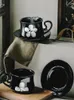 Tassen Ahunderjiaz-Retro Black Coffee Coffee Tasse und Untertasse Set Daisy Druck mit Griff Haus Dining Tabletop Dekoration Getränkware