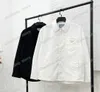 22SS Vestes de vêtements de sport d'automne mince en cuir en nylon Triangle en métal label vêtements de streetwear couches masculines vêtements noirs blanc mxl9703427