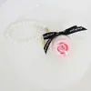 Partihandel högkvalitativ vacker pärla bevarad rosblomma nyckelring för kvinnor väska bilkedja gåva