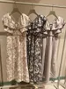 Grundläggande casual klänningar Wakuta Japan ärmlös inslagna midjan mantel söt v-ringad design vestidos de mujer 2024 tidigt vår ruffle tryck klänning q240430